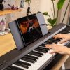 Yamaha P-145 with Smart Pianist app open on music stand